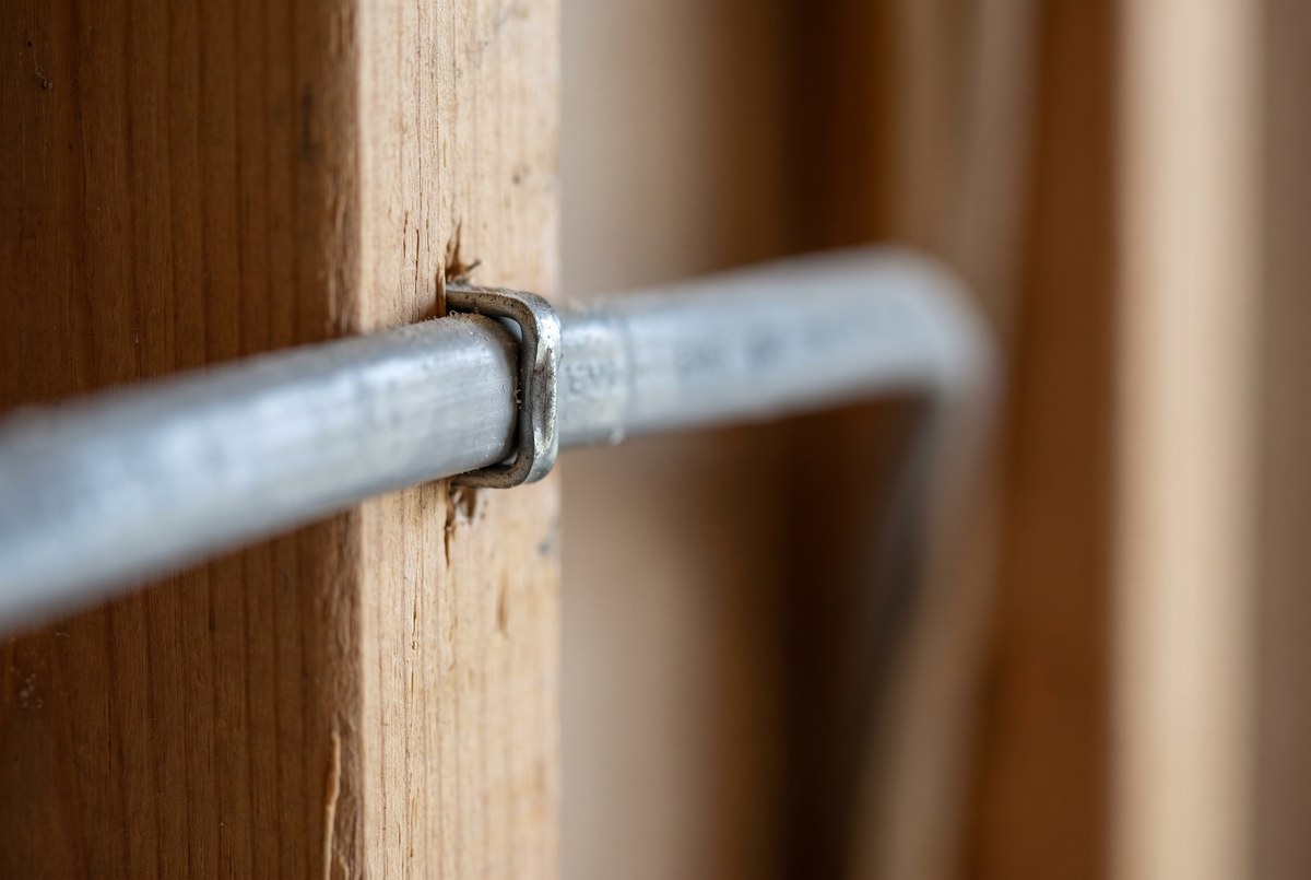 A partially framed basement space with electrical rough-ins visible