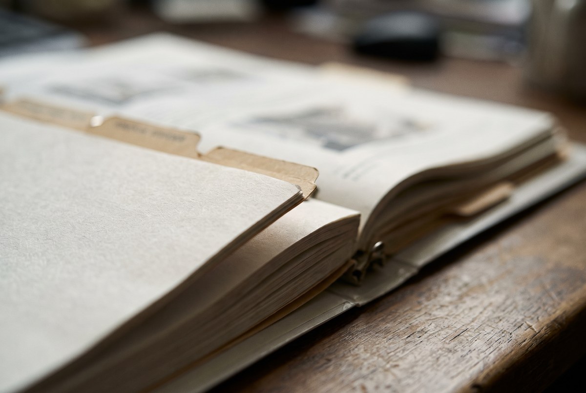 A close-up of a specification binder, shallow depth of field