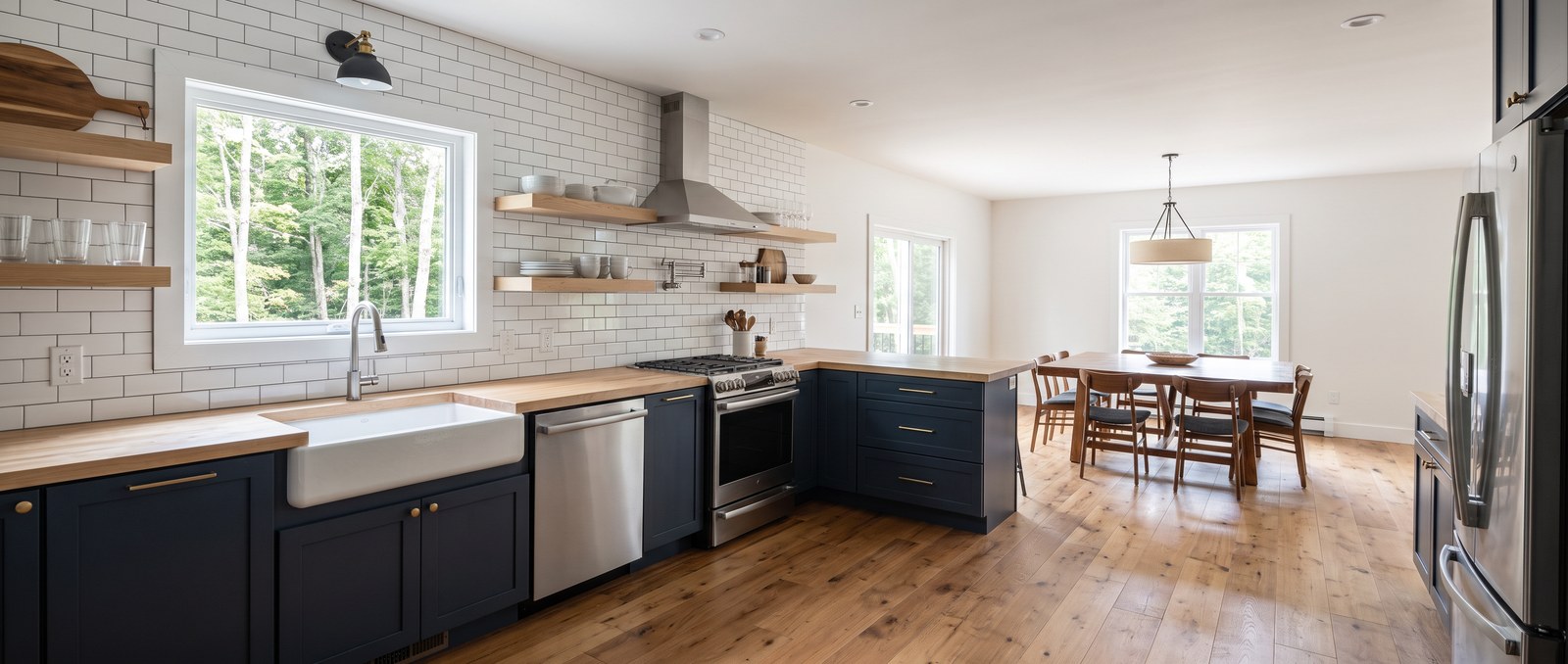 A renovated kitchen with new countertops and a for-sale sign visible through the window